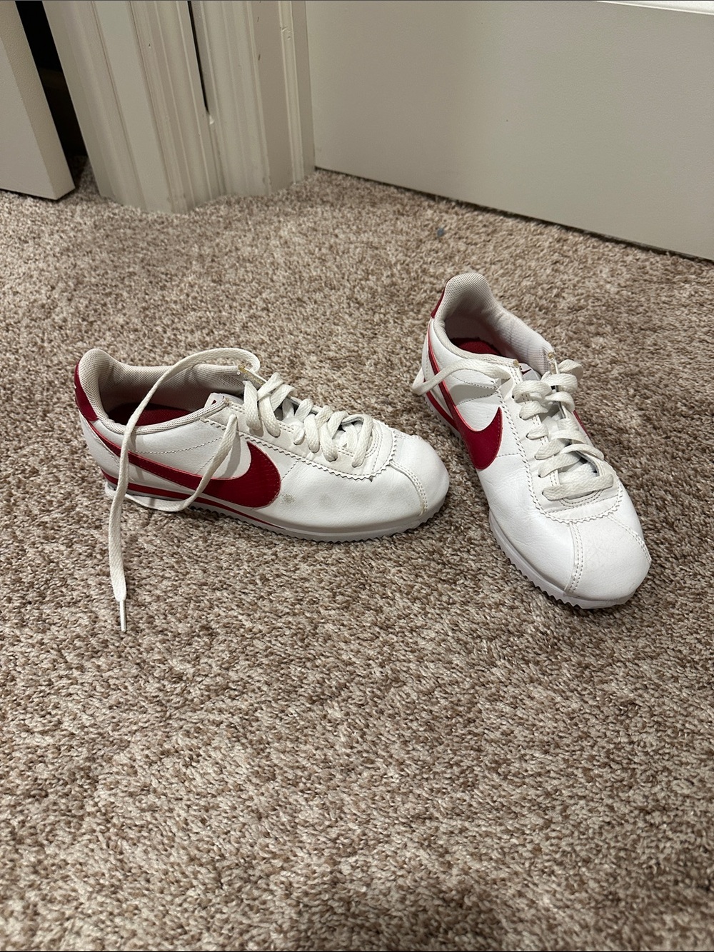 Nike Women’s White Sneakers with Red Swoosh